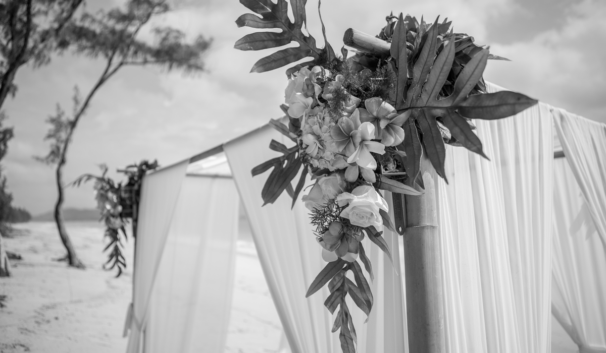 black and white beach wedding in Hawaii closup of the arch