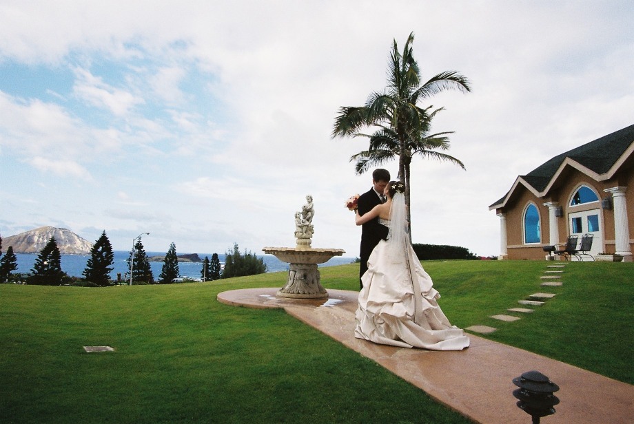 Karen dancing at her Hawaii church wedding over looking the ocean