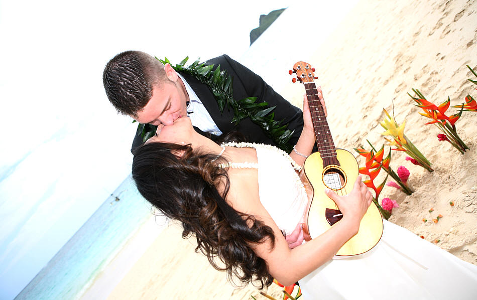 playing the ukulele while kissing her husband