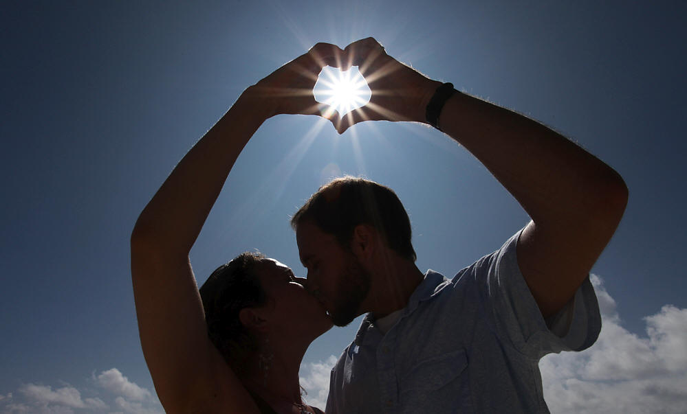 Sun shinning through the hand at lankia beach during the morning hours