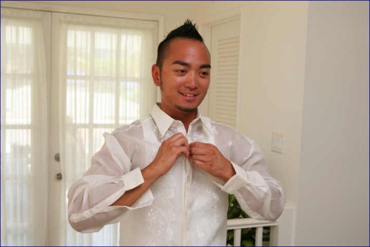 Chris buttoning his white shirt