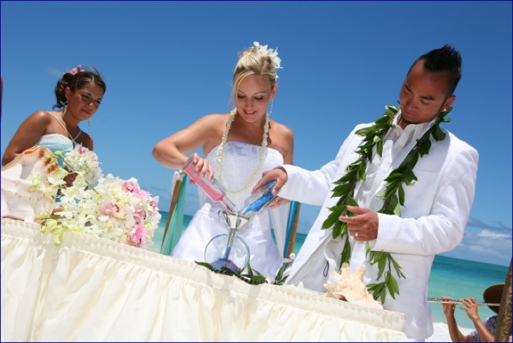 The sand ceremony at the table on the beach