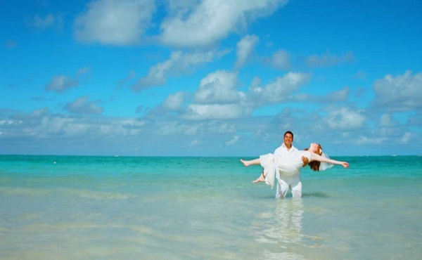 Ashley and her groom in the water at Lanikai, close up