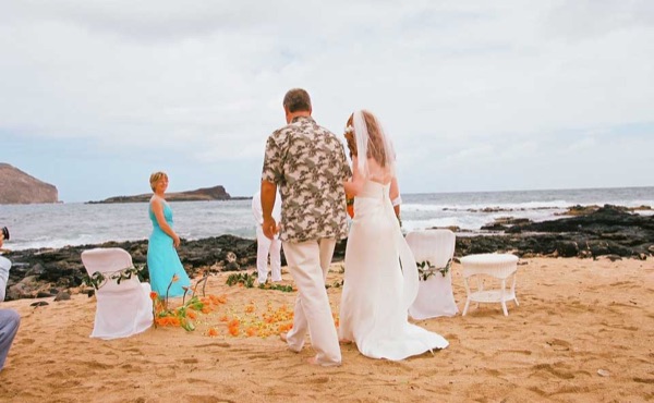 The aisle of orange flowers by the sea, close up