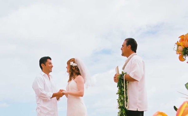 Ashley's wedding ceremony on the beach, in the sunshine