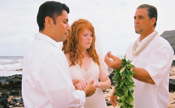 Ashley's wedding ceremony on the beach, laughing together