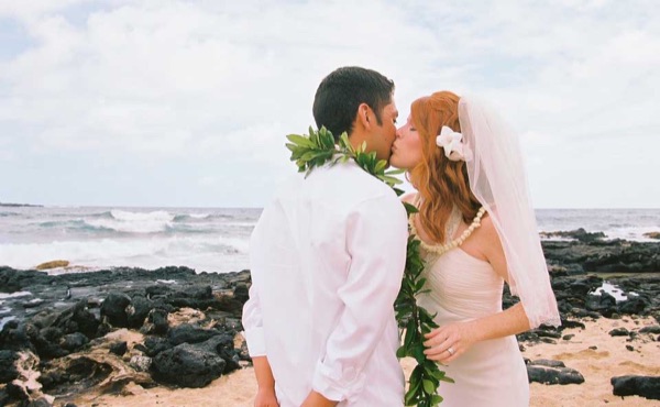 Ashley's wedding ceremony on the beach, looking at each other