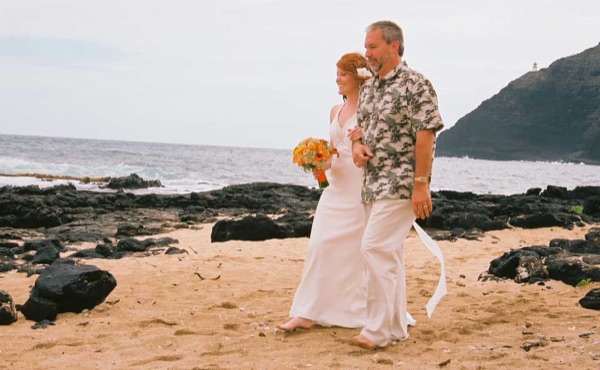 Ashley and her groom during the ceremony by the lava rocks, close up