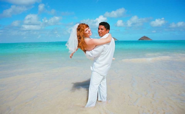 Going into the water for Ashley's trash the dress shoot, smiling