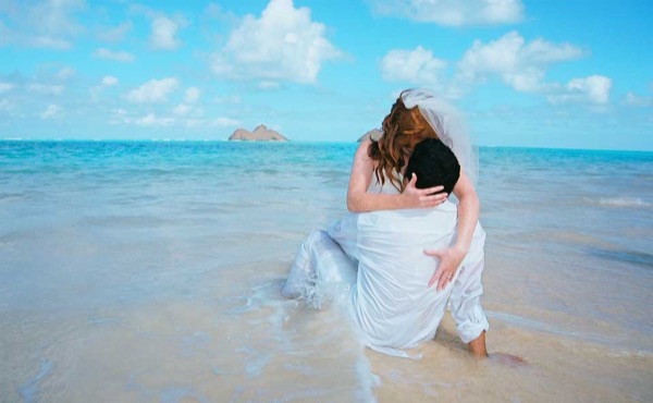 Going into the water for Ashley's trash the dress shoot, looking at each other