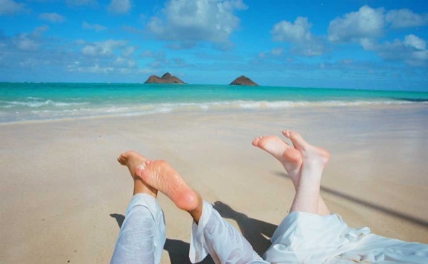 Legs on the beach of love with Ashley and her groom, close up