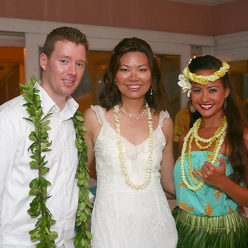 Christine and Matthew in their leis with the hula dancer