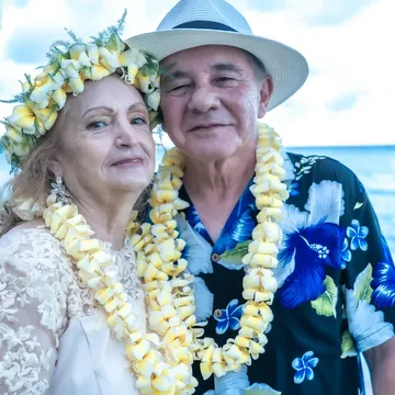 Daniel and Shirley in yellow plumeria leis at Kahala