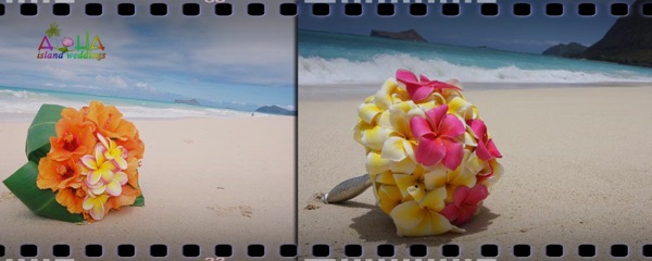 Colorful yellow and pink plumeria bouquets on the sandy beach