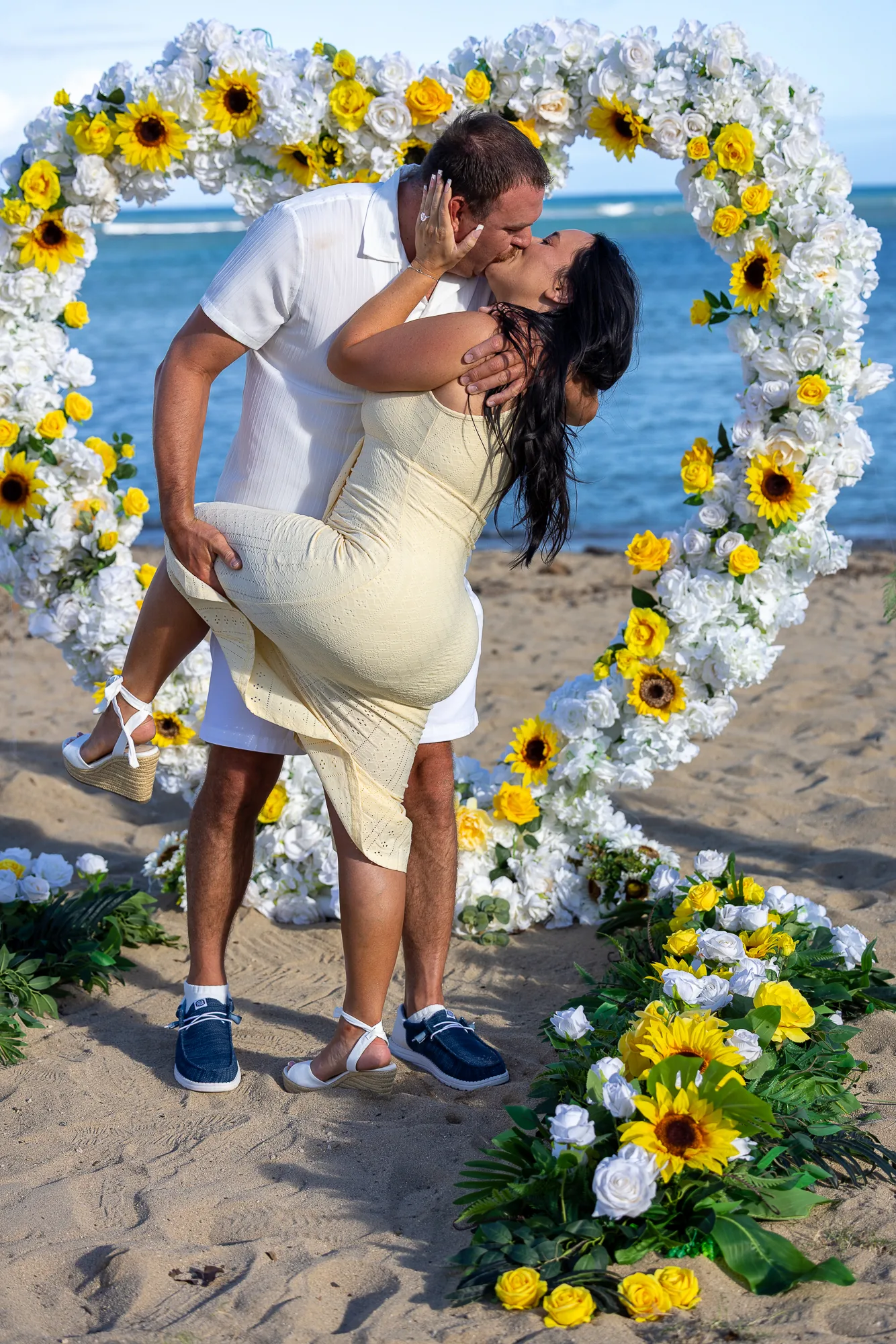 Their first kiss as fiances in the flower heart