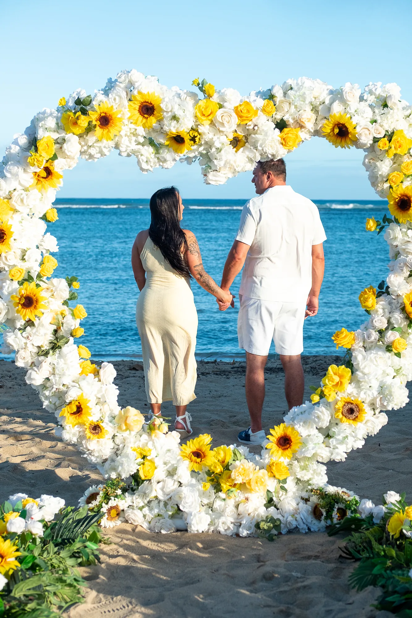 Hand in hand seen through the flower heart