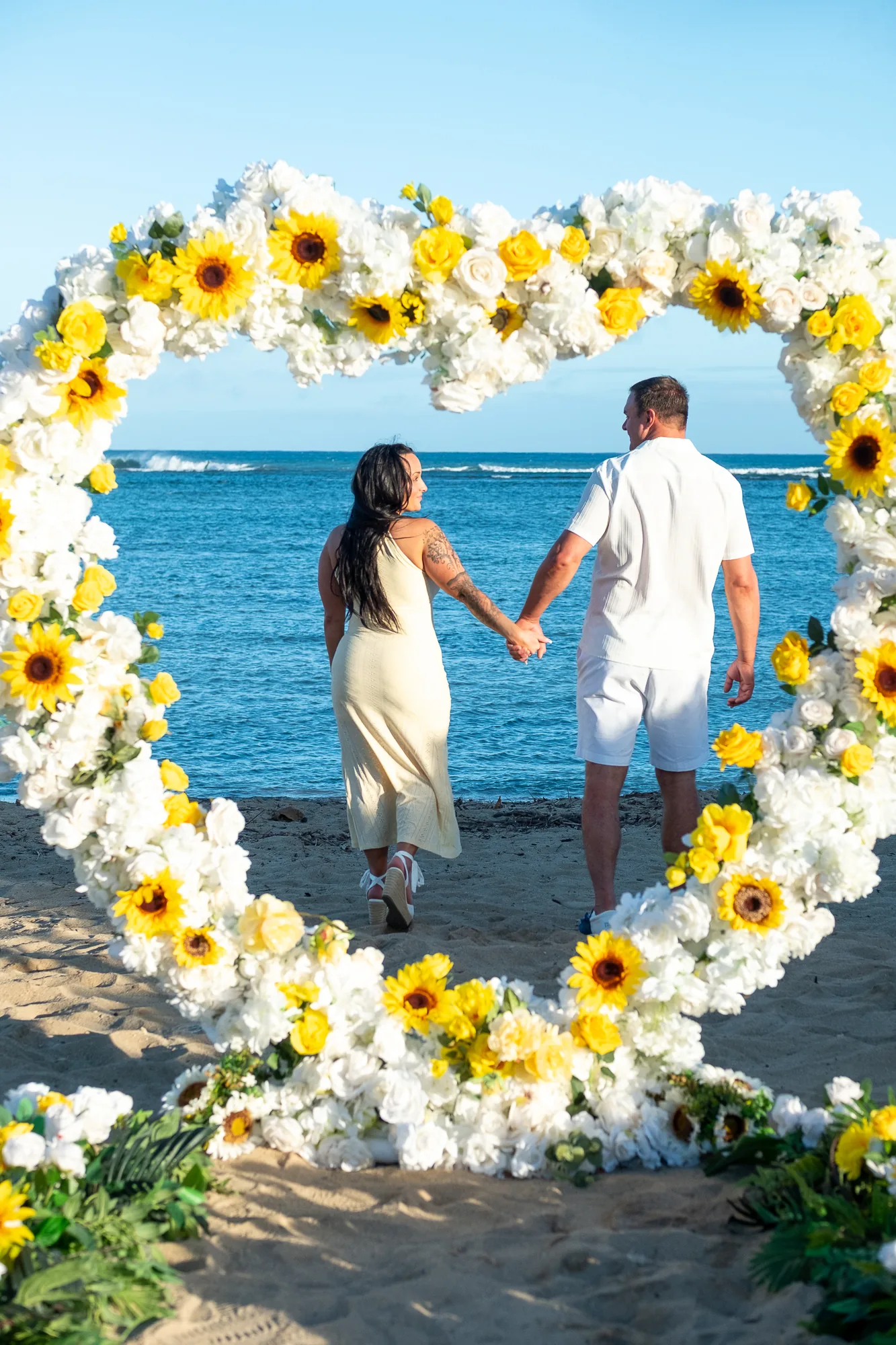 The flower heart framing them and the ocean