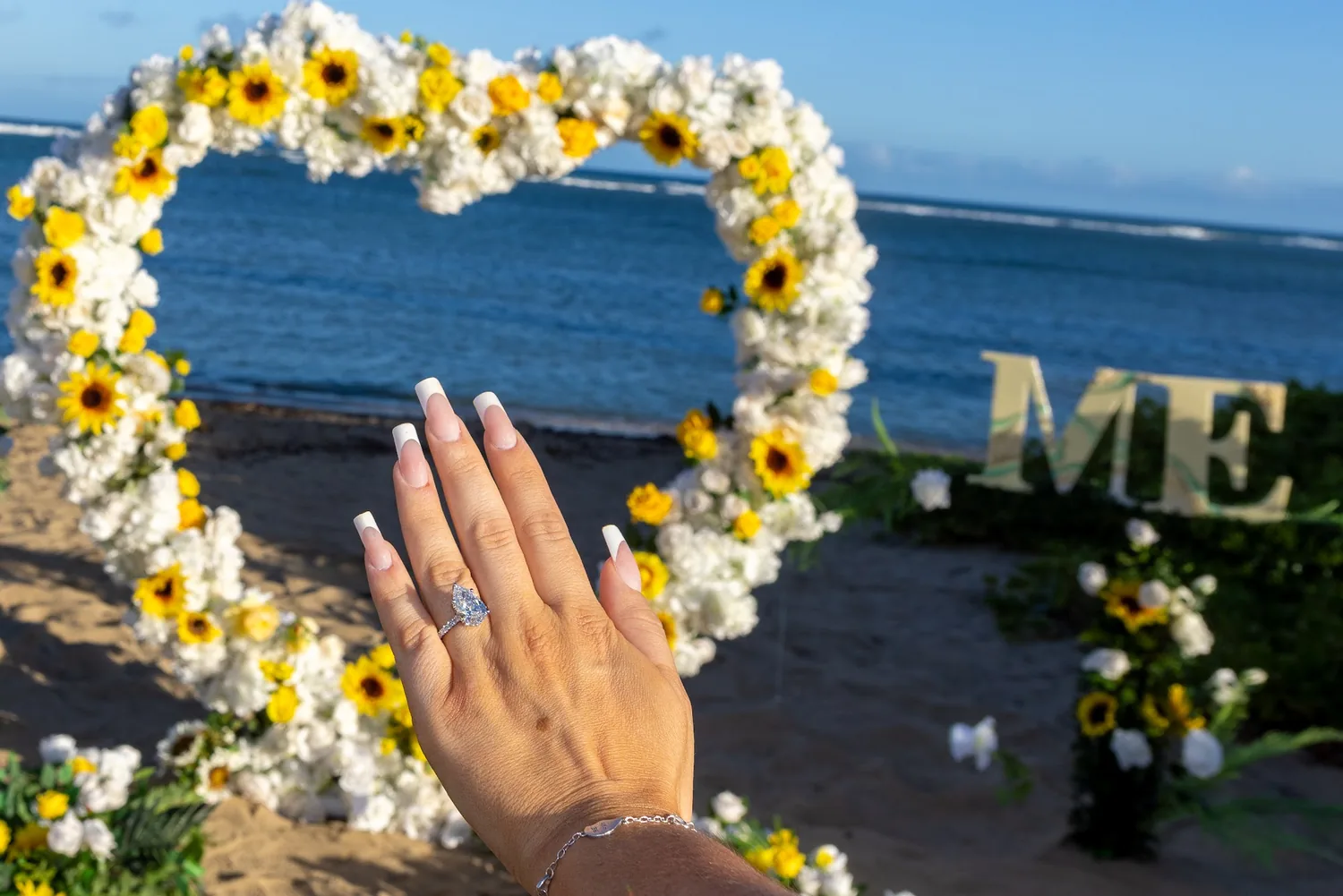 Her new ring with the flower heart behind