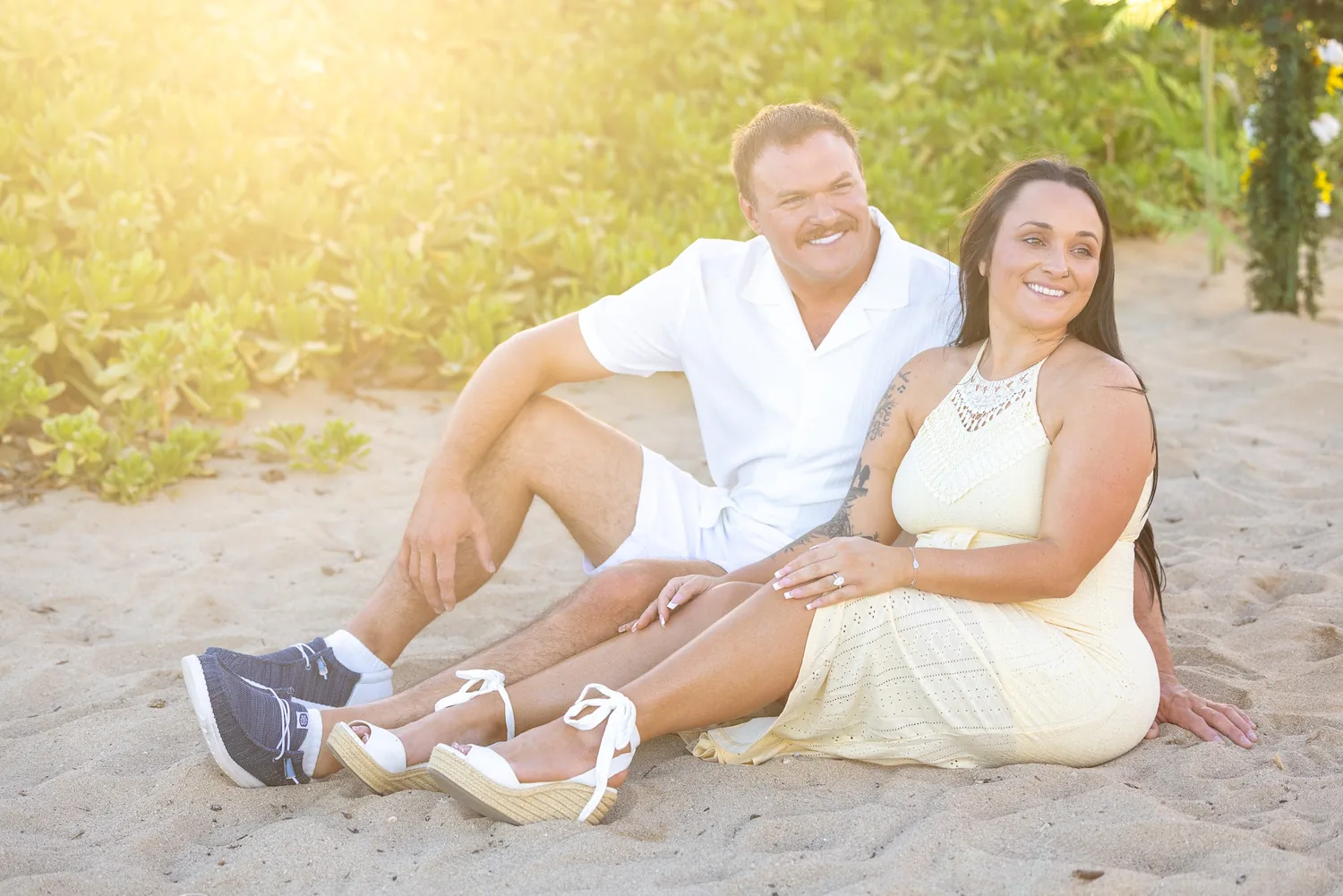 Soft sunlight as they sit on the sand