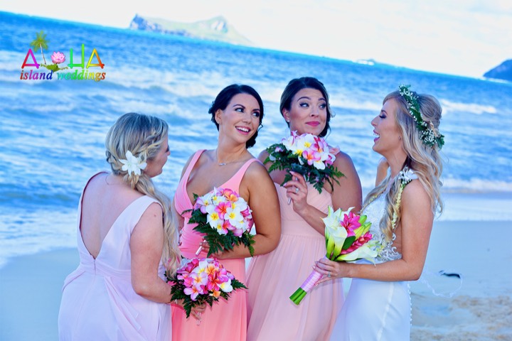 Bridesmaids in small haku leis of Hawaiian orchids and baby's breath