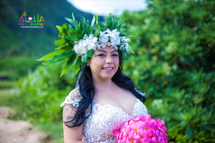 Bride wearing a white orchid haku lei at a Waimanalo beach wedding