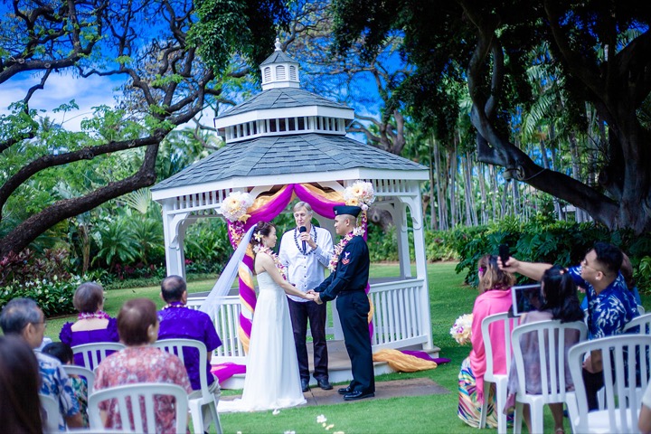 Bryan and Rie's ceremony under the white gazebo in the Luau Gardens, with guests seated on the lawn