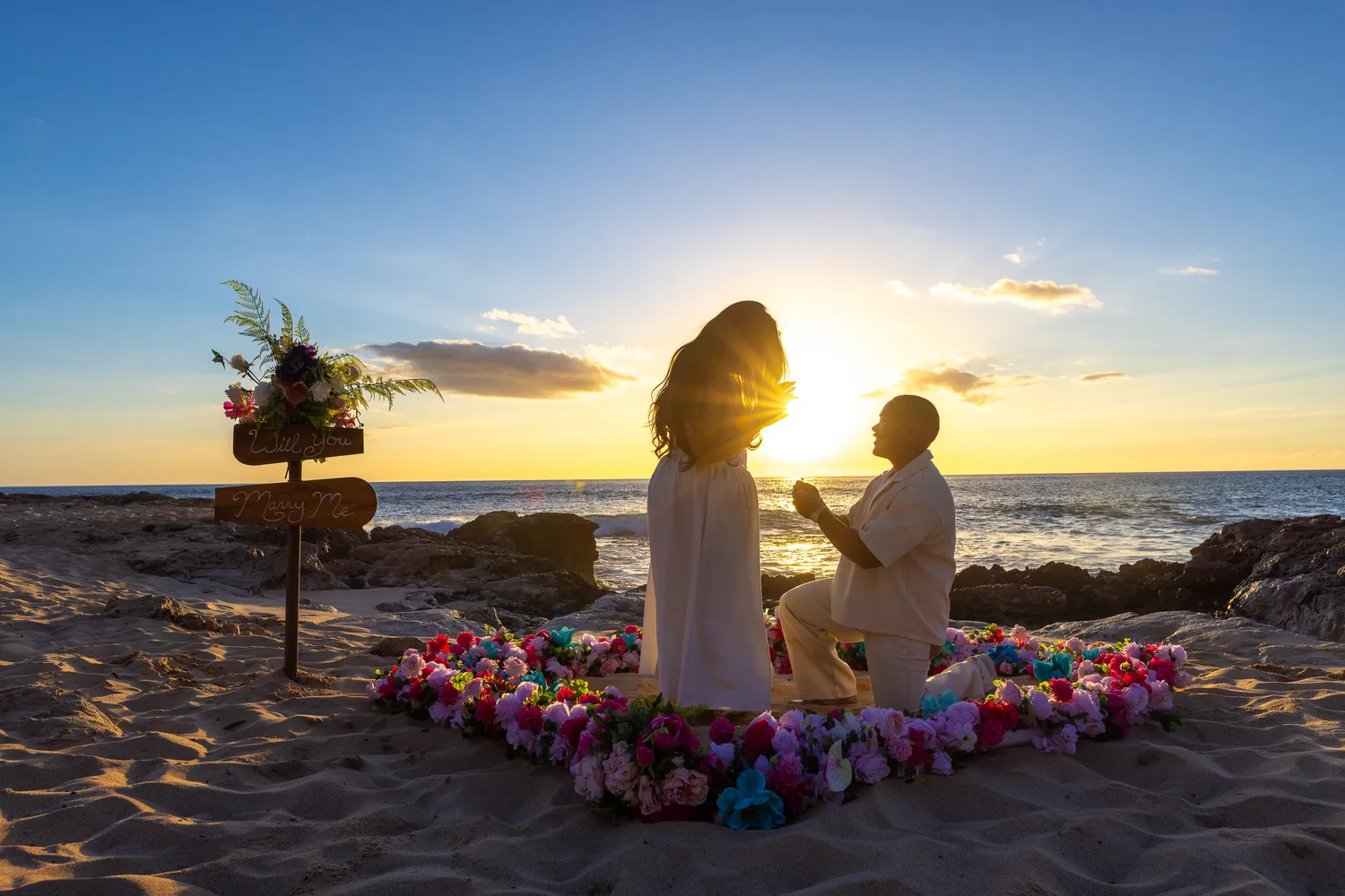Proposal on one knee in the flower heart, at a horseback proposal on Oahu