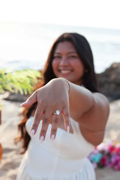 Bride to be showing her engagement ring, at a horseback proposal on Oahu