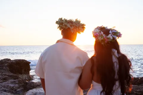 Haku leis at sunset by the rocks, at a horseback proposal on Oahu