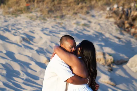 Hug after she said yes, at a horseback proposal on Oahu
