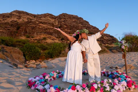 Joyful celebration after yes, at a horseback proposal on Oahu