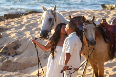Kiss between the two horses, at a horseback proposal on Oahu