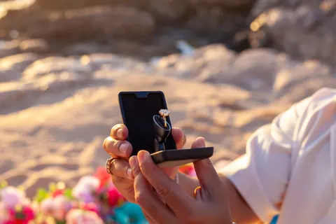 Ring box opened on the sand, at a horseback proposal on Oahu