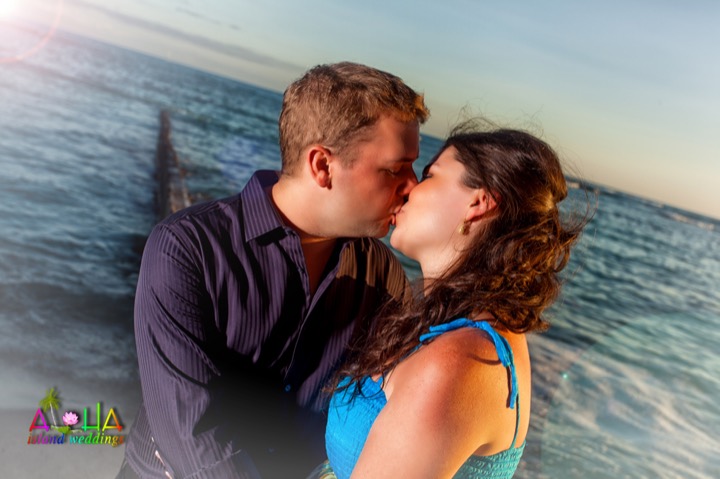 David and Danielle kissing at sunset after their reception at the Hilton Hawaiian Village