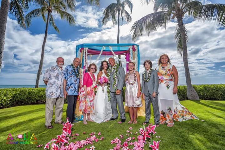 Family gathered at the bamboo altar at Paradise Cove