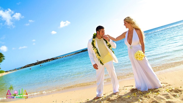 Couple on the beach at Paradise Cove on the west side of Oahu
