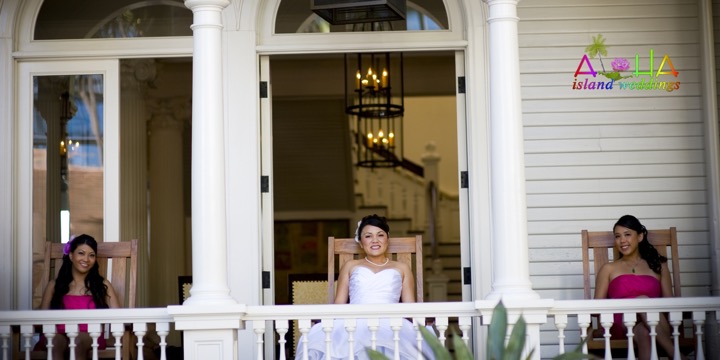 Bride and bridesmaids on the hotel's white balcony