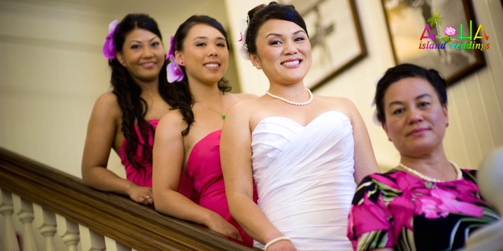 Bride and bridesmaids in pink inside the Royal Hawaiian Hotel