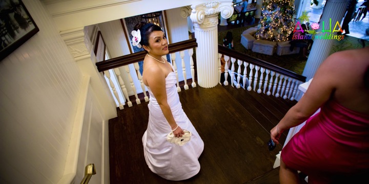 Bride on the white balcony of the Royal Hawaiian Hotel