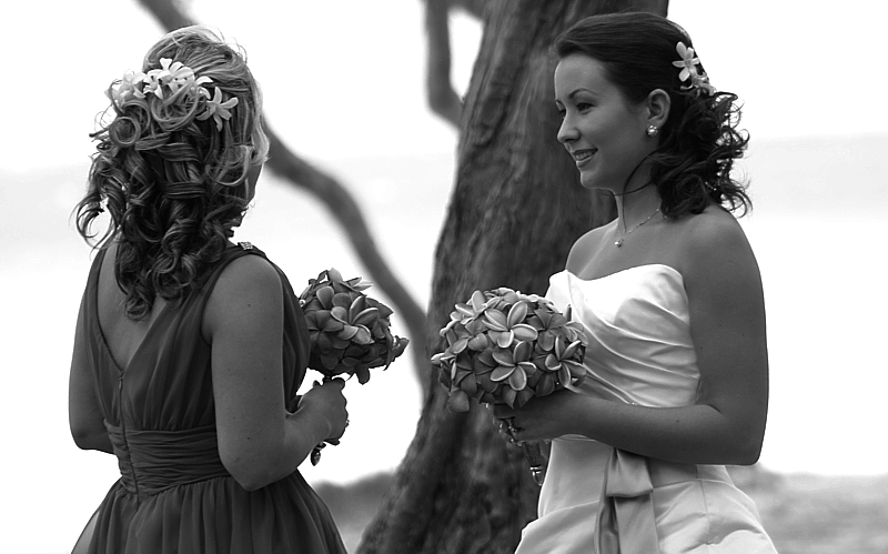 black and white photo of the bride talking with her bridesmaid