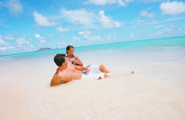 Jamillah and Brandon at Lanikai beach, arm in arm