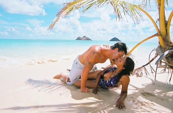 Jamillah and Brandon at Lanikai beach, with the clouds above