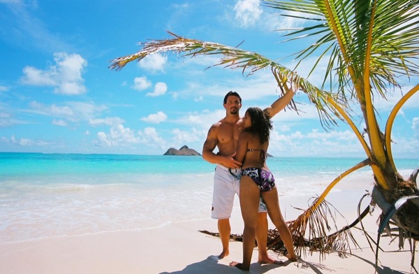 Jamillah and Brandon at Lanikai beach, laughing together