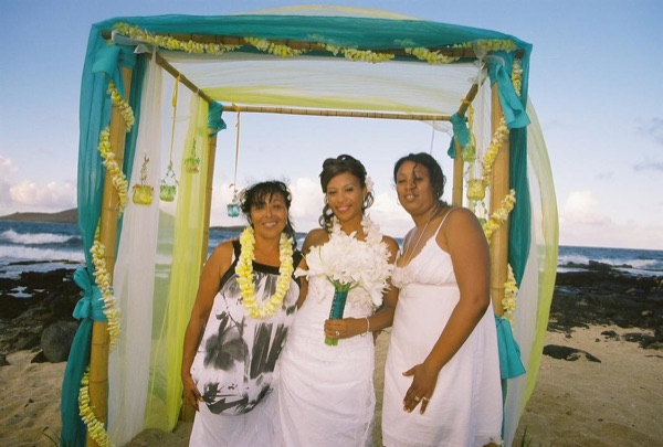 Family and friends with Jamillah and Brandon, under a blue sky