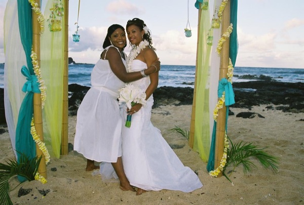 Family and friends with Jamillah on the beach, close up