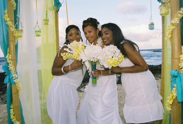 Family and friends with Jamillah on the beach, from another angle