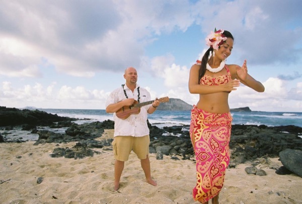 The hula dancer dancing for the guests before the ceremony