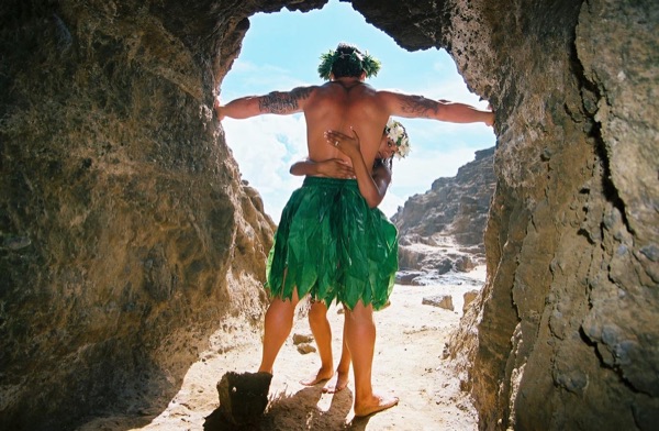 Jamillah and Brandon in a lava tube cave by the beach, up close