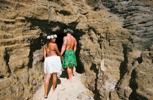 Jamillah and Brandon in a lava tube cave by the beach