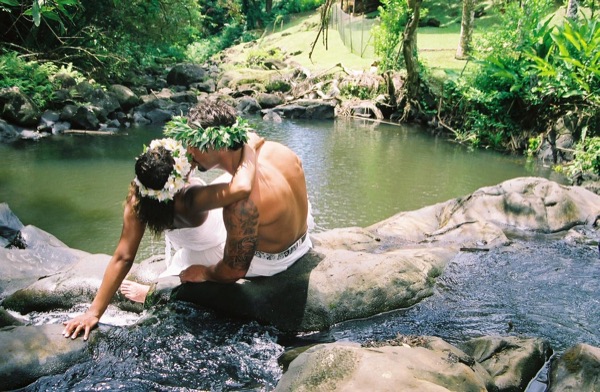 Jamillah and Brandon in the Nuuanu rainforest, looking at each other